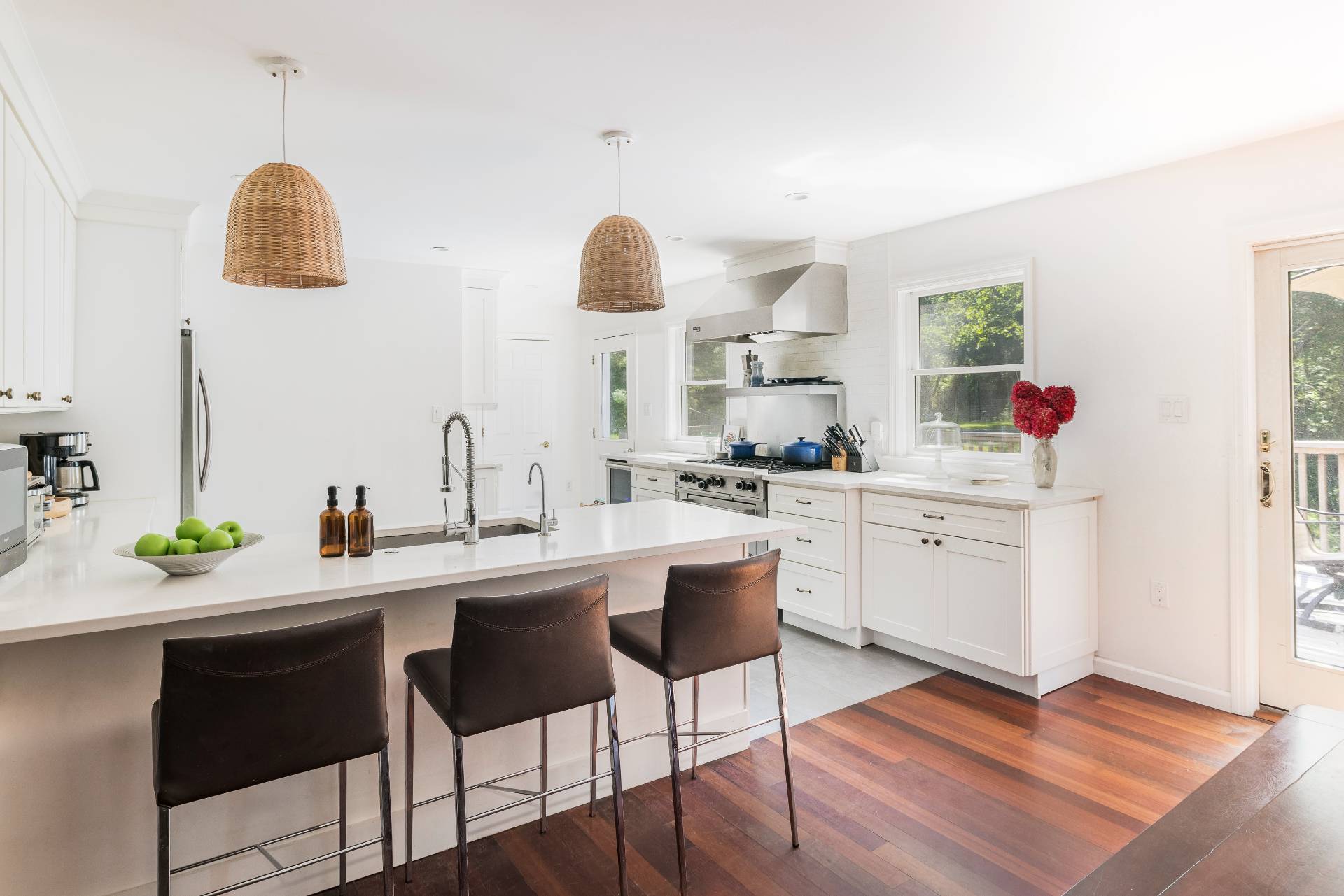 312 Noyack Road Southampton, NY 11968 - Photo 8 of 18 a kitchen with a sink cabinets and window