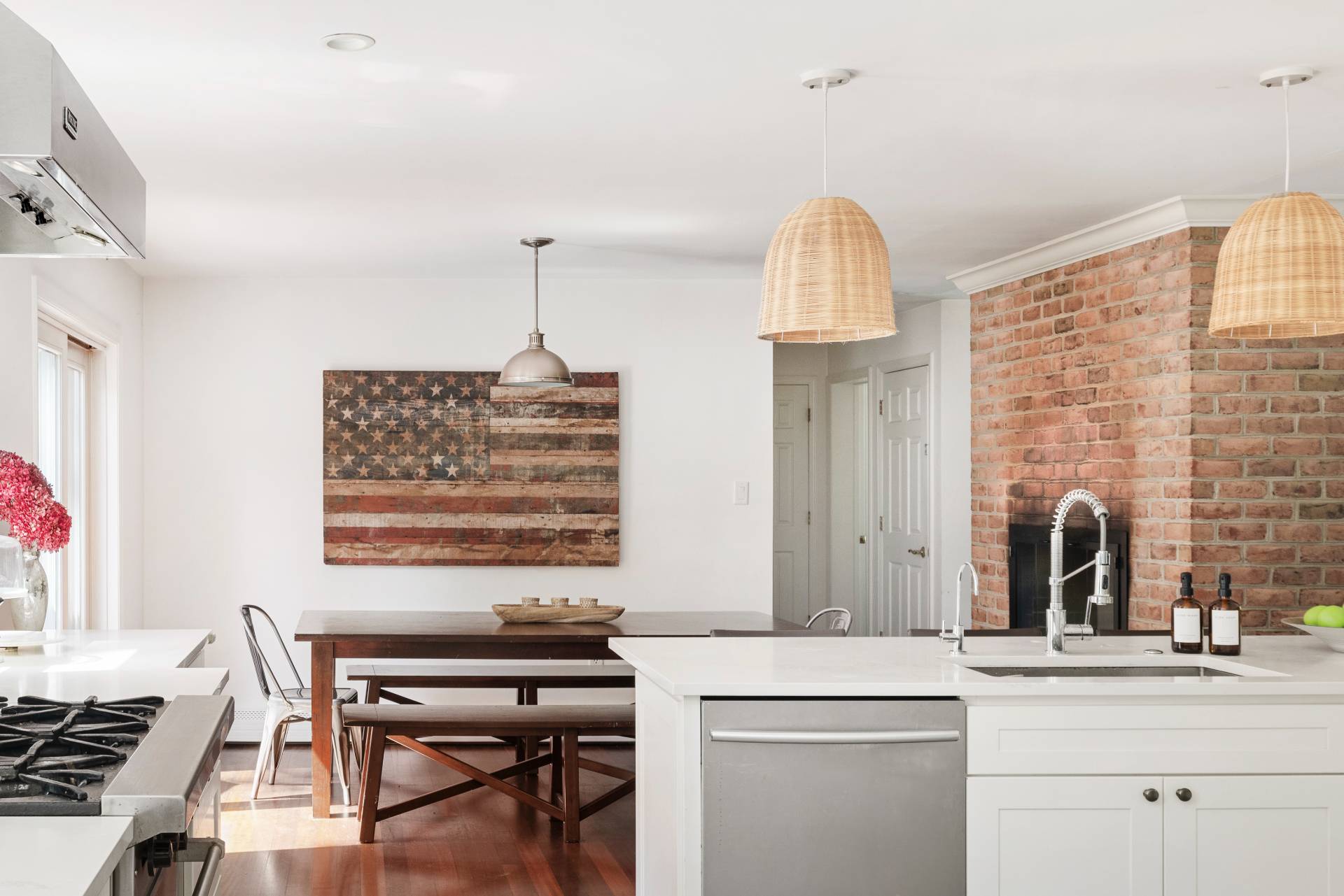 312 Noyack Road Southampton, NY 11968 - Photo 9 of 18 a kitchen with a sink stove and cabinets