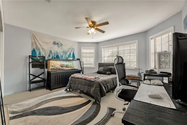 a bedroom with furniture and a window