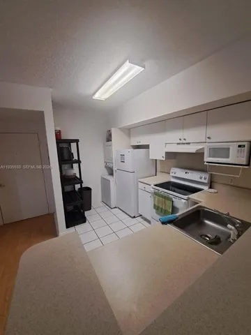 a bedroom with a bed and a stove