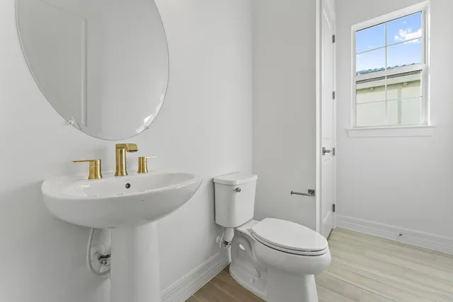 a kitchen with kitchen island a sink stainless steel appliances and cabinets