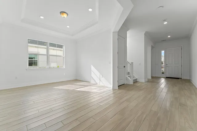 a kitchen with stainless steel appliances granite countertop a sink a stove and a wooden floors