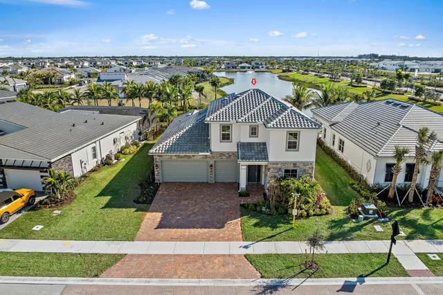 a aerial view of a house with a yard