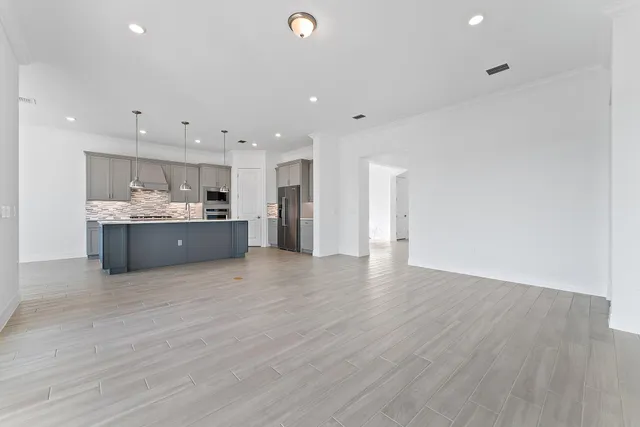a spacious bathroom with a double vanity sink and a mirror