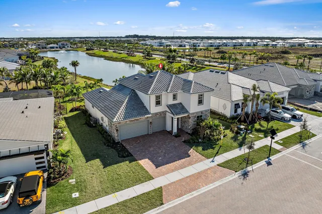 an aerial view of a house with a ocean view