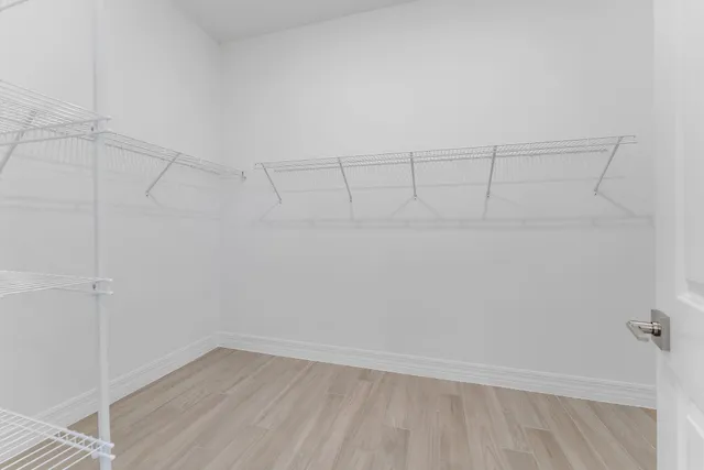 a view of a garden with a building in the background