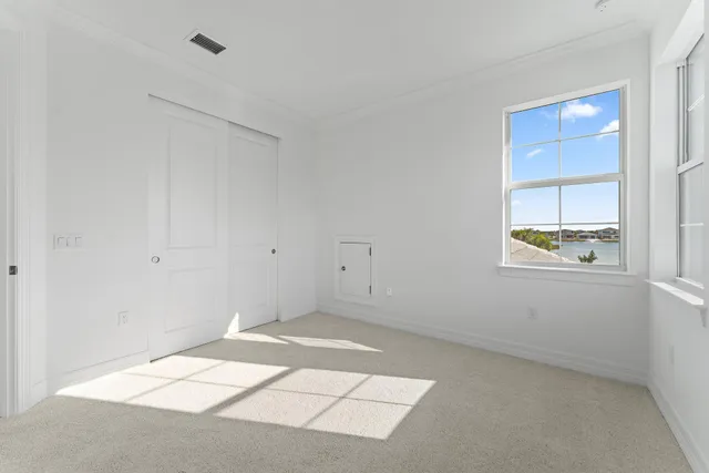 a view of a backyard with swimming pool and sitting area