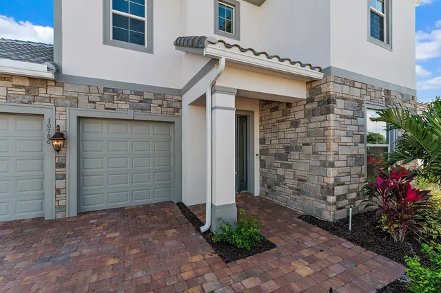 a bathroom with a sink toilet and a mirror