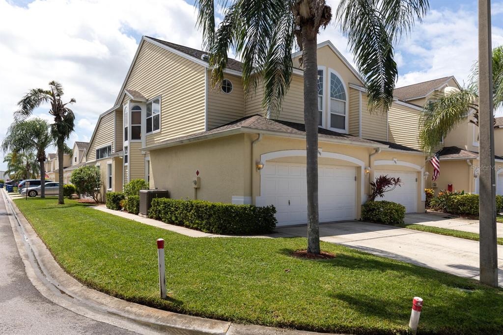1050 Starkey Road, Unit 501 Largo, FL 33771 - Photo 1 of 1 a view of a white house with a yard and plants