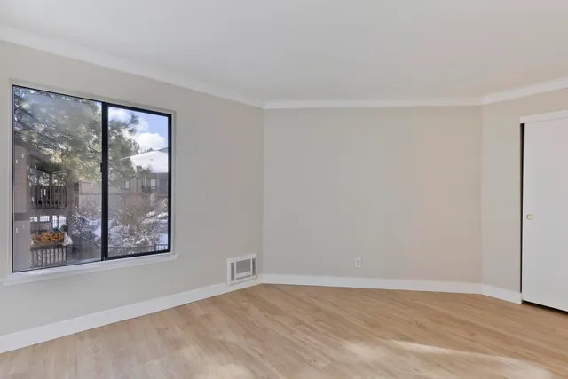 a view of an empty room with a window