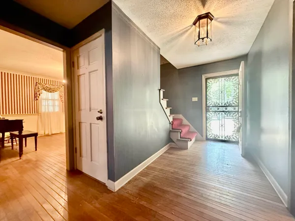 a kitchen with stainless steel appliances granite countertop a refrigerator a stove and a sink with cabinets