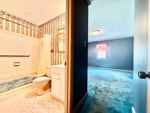 an empty room with an empty space and windows