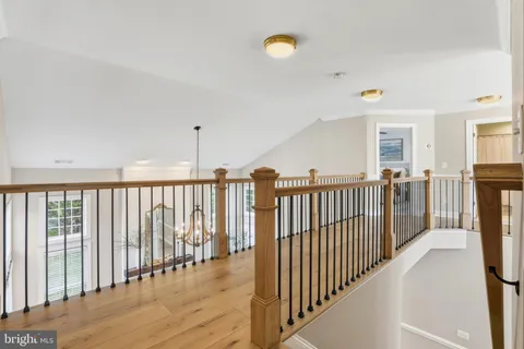 a bedroom with bed and a table