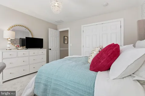 a bedroom with bed and window