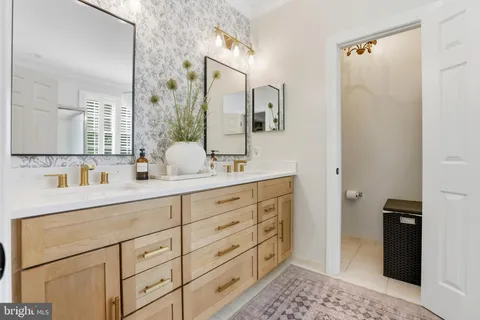 a bathroom with a sink double vanity and a mirror