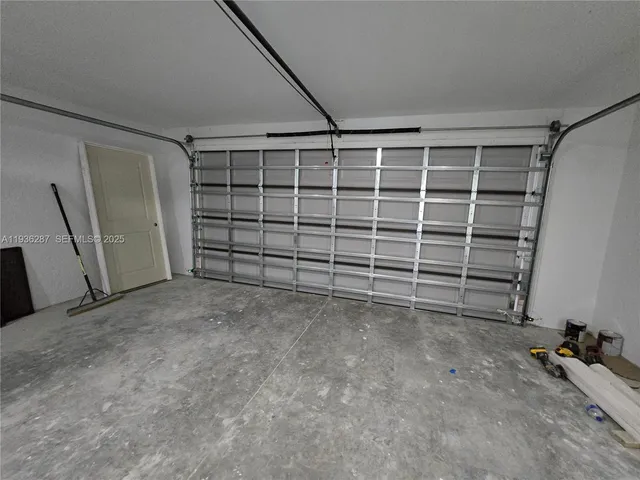 a view of an empty room with a balcony