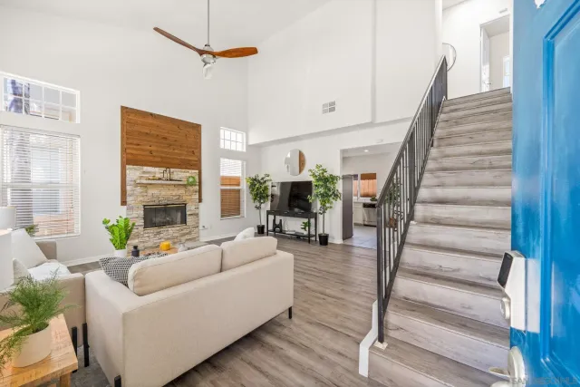a living room with furniture and a fireplace