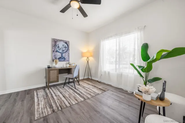 a workspace with furniture and a potted plant
