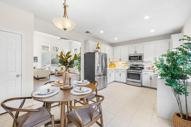 a kitchen with stainless steel appliances kitchen island granite countertop a kitchen island hardwood floor and stove