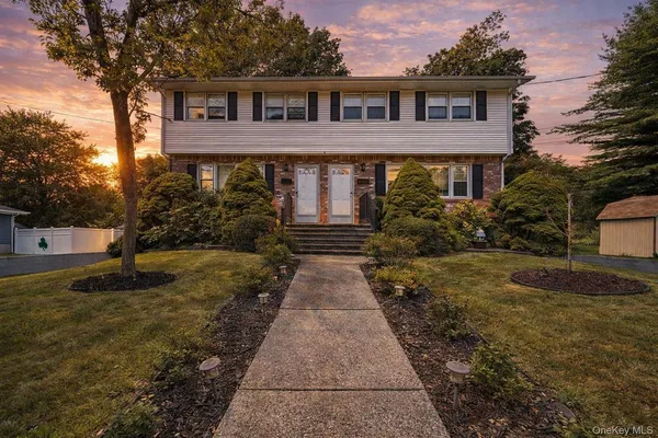 a front view of a house with yard