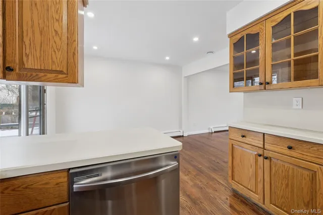 a view of an entryway with wooden floor