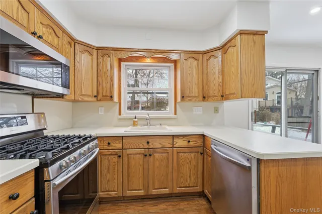 a kitchen with a sink stove and cabinets