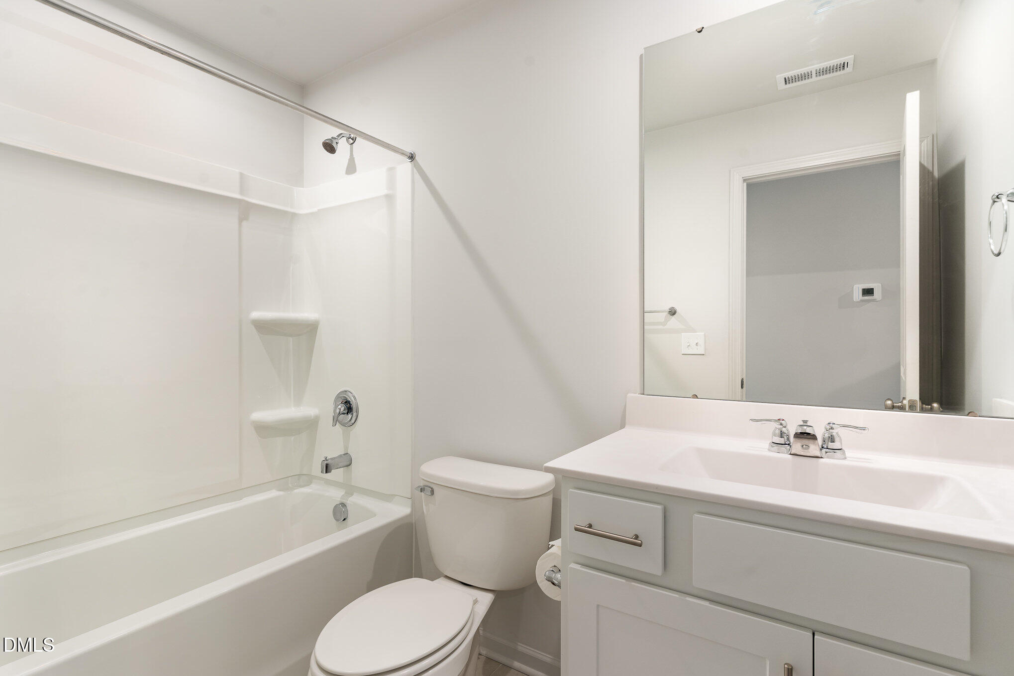 385 Dasu Drive, Unit 1 Clayton, NC 27520 - Photo 14 of 17 a bathroom with a sink toilet vanity and bathtub