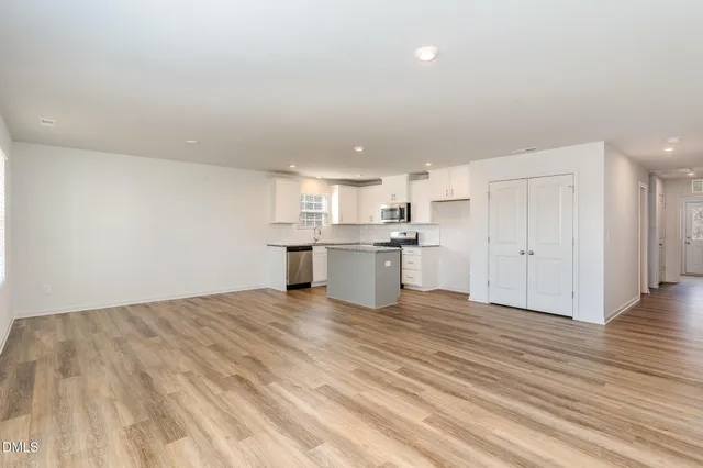 a view of kitchen with wooden floor