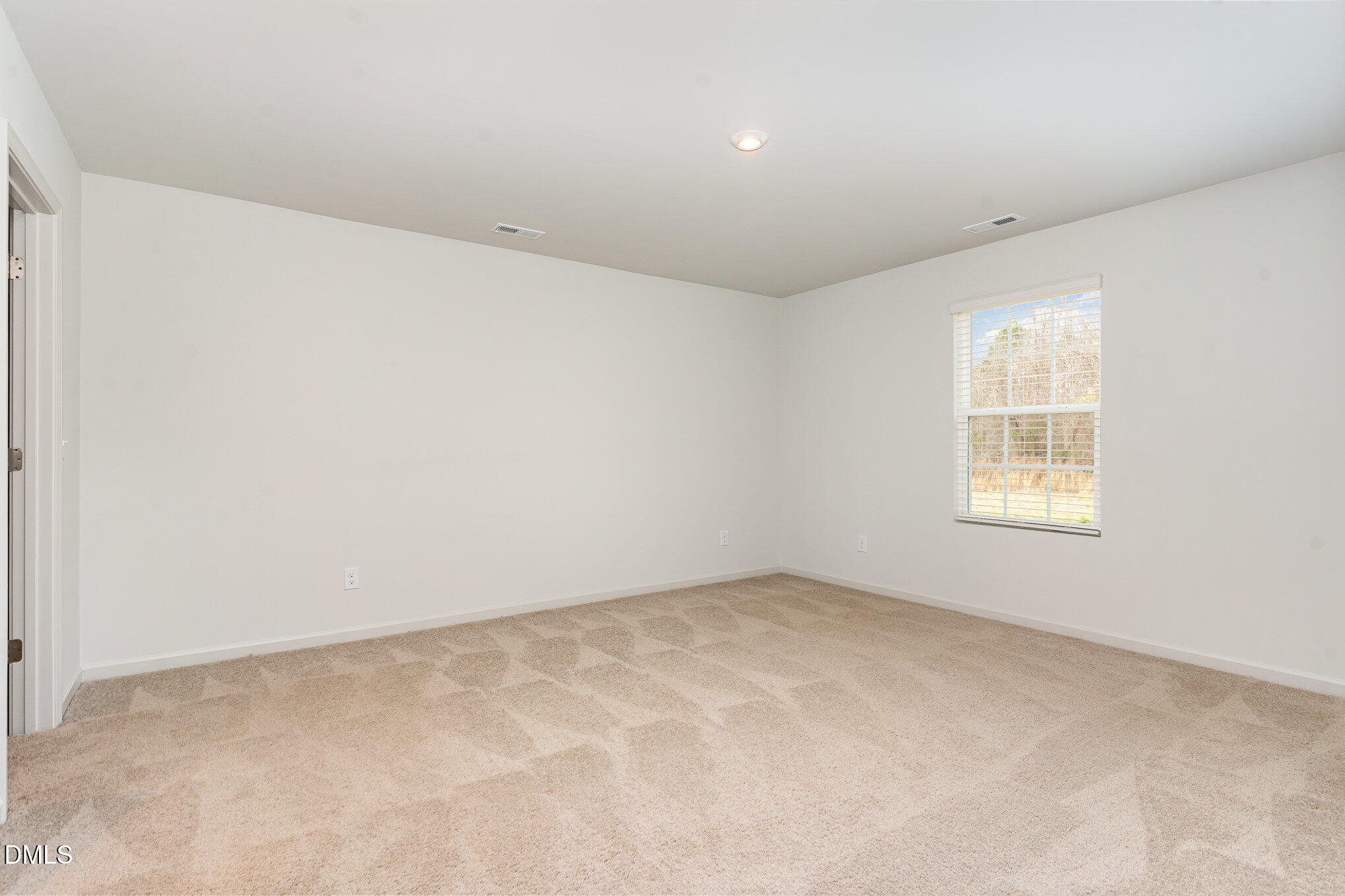 385 Dasu Drive, Unit 1 Clayton, NC 27520 - Photo 8 of 17 an empty room with a window