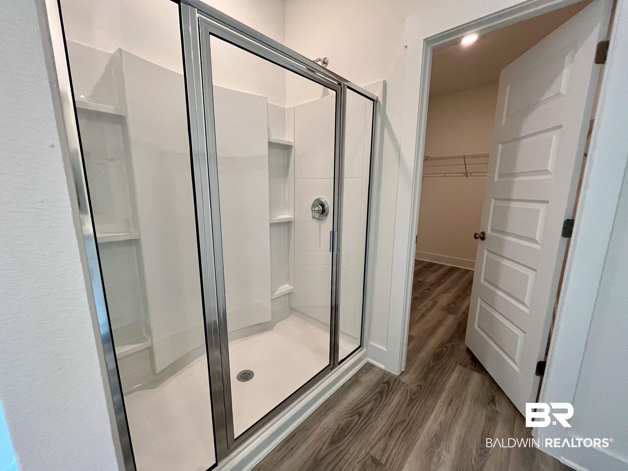 334 Barndling Street Fairhope, AL 36532 - Photo 31 of 34 Bathroom featuring hardwood / wood-style floors and an enclosed shower