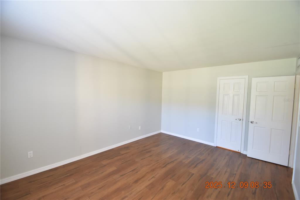 3402 Latania Drive, Unit 316 Tampa, FL 33618 - Photo 11 of 36 a view of an empty room with wooden floor