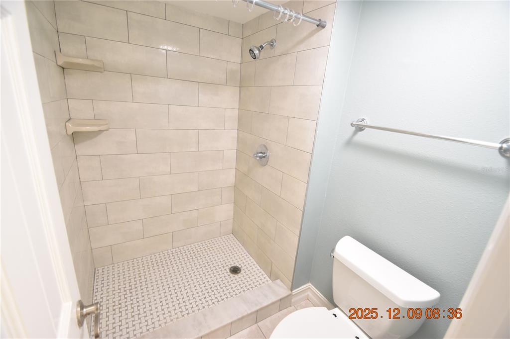 3402 Latania Drive, Unit 316 Tampa, FL 33618 - Photo 14 of 36 a bathroom with a shower and toilet