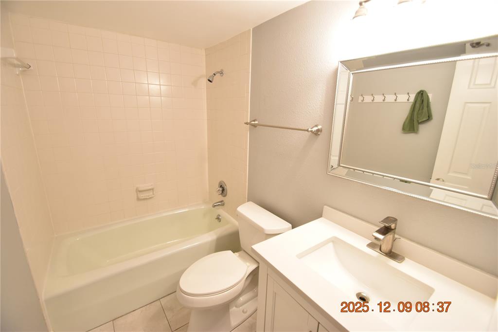 3402 Latania Drive, Unit 316 Tampa, FL 33618 - Photo 19 of 36 a bathroom with a sink a toilet and a bathtub