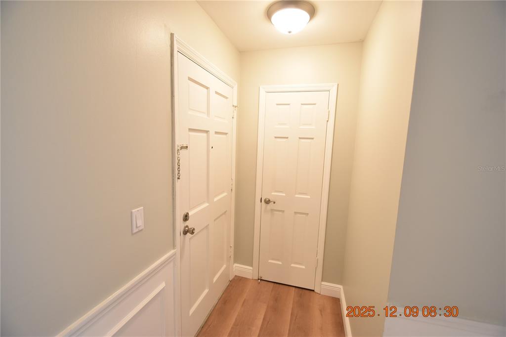 3402 Latania Drive, Unit 316 Tampa, FL 33618 - Photo 2 of 36 a view of a hallway with wooden floor