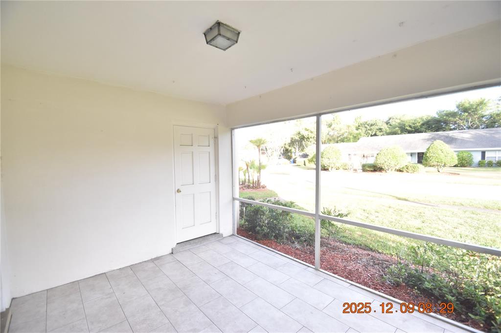 3402 Latania Drive, Unit 316 Tampa, FL 33618 - Photo 21 of 36 a view of a room with wooden floor and windows