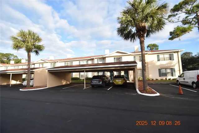 a view of swimming pool with a table and chairs