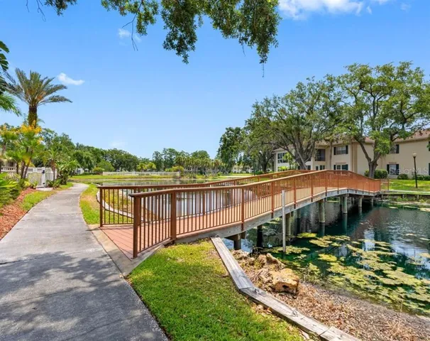 a view of a wooden deck with a lake view