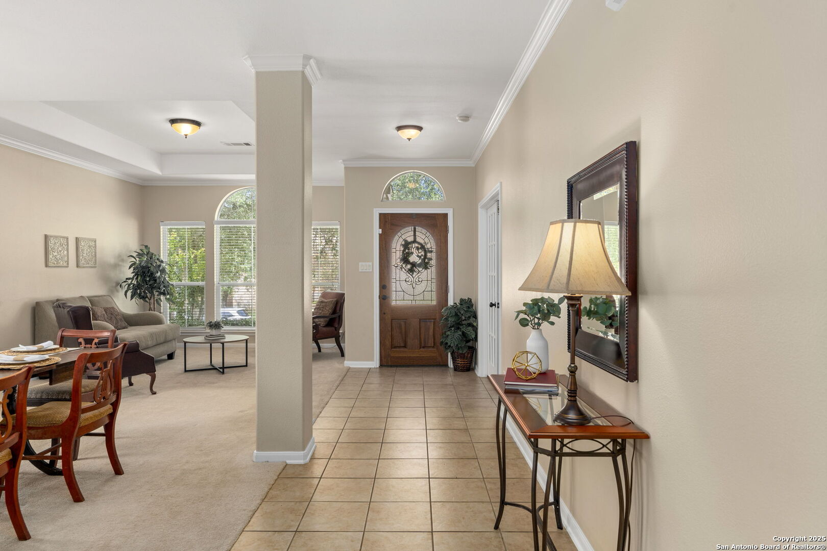 16106 Ponderosa Pth Helotes, TX 78023 - Photo 12 of 40 a living room with furniture a fireplace and a potted plant