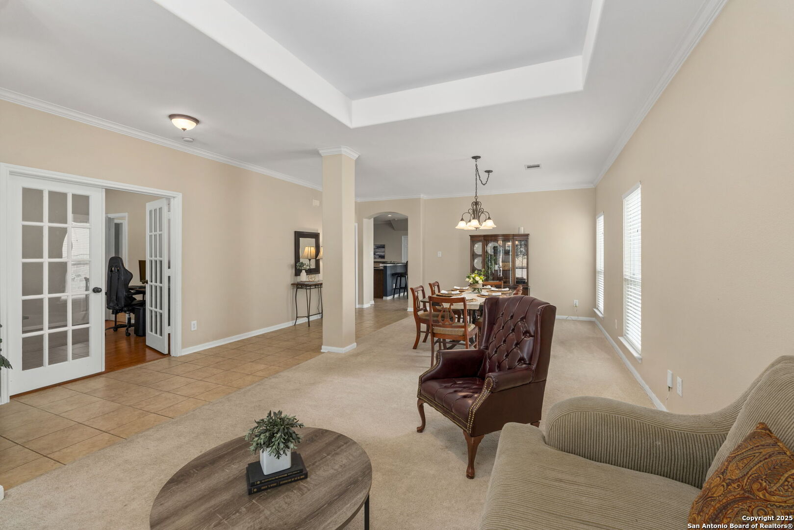 16106 Ponderosa Pth Helotes, TX 78023 - Photo 14 of 40 a living room with furniture and a chandelier