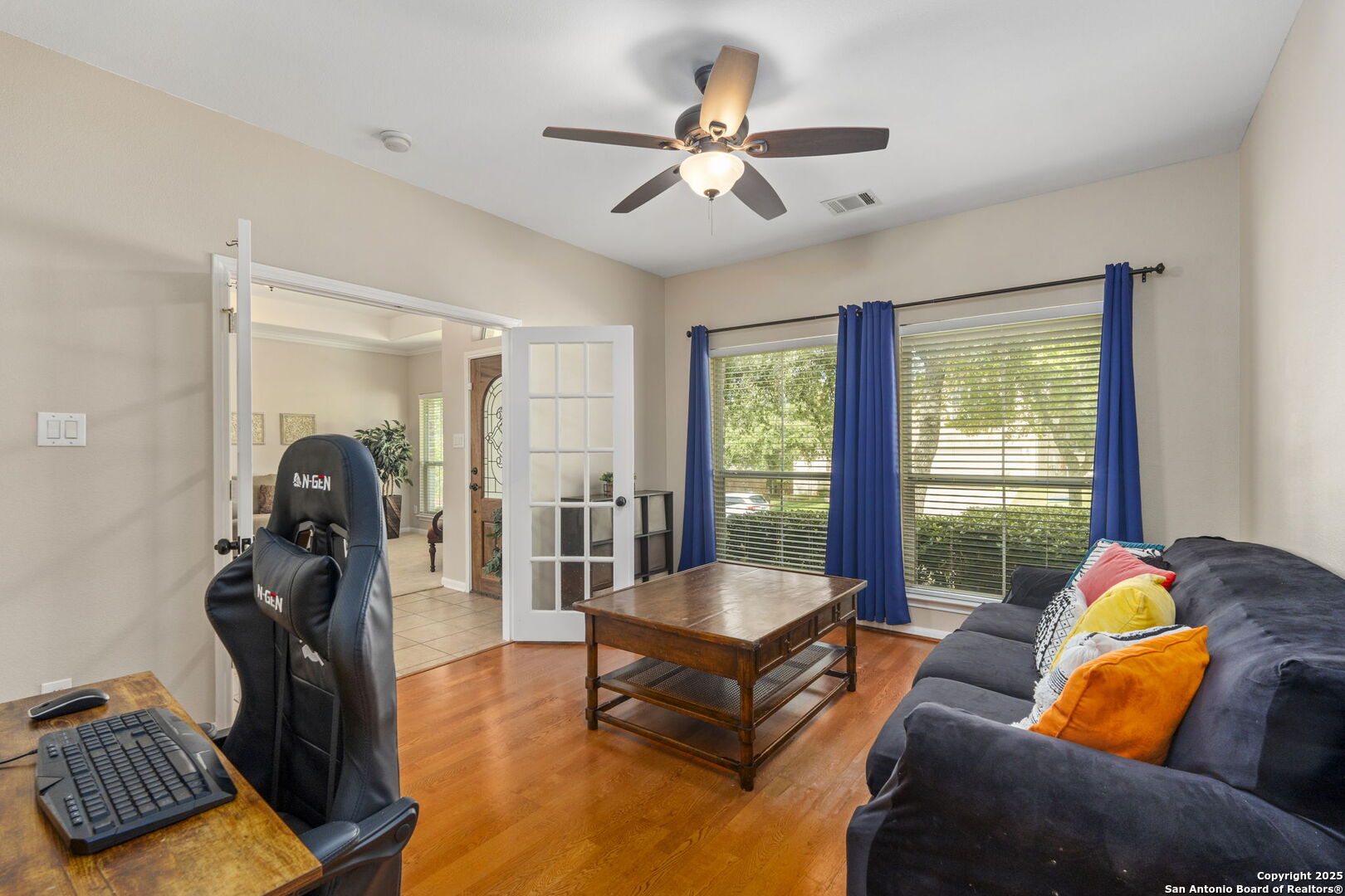 16106 Ponderosa Pth Helotes, TX 78023 - Photo 16 of 40 a living room with furniture and a chandelier