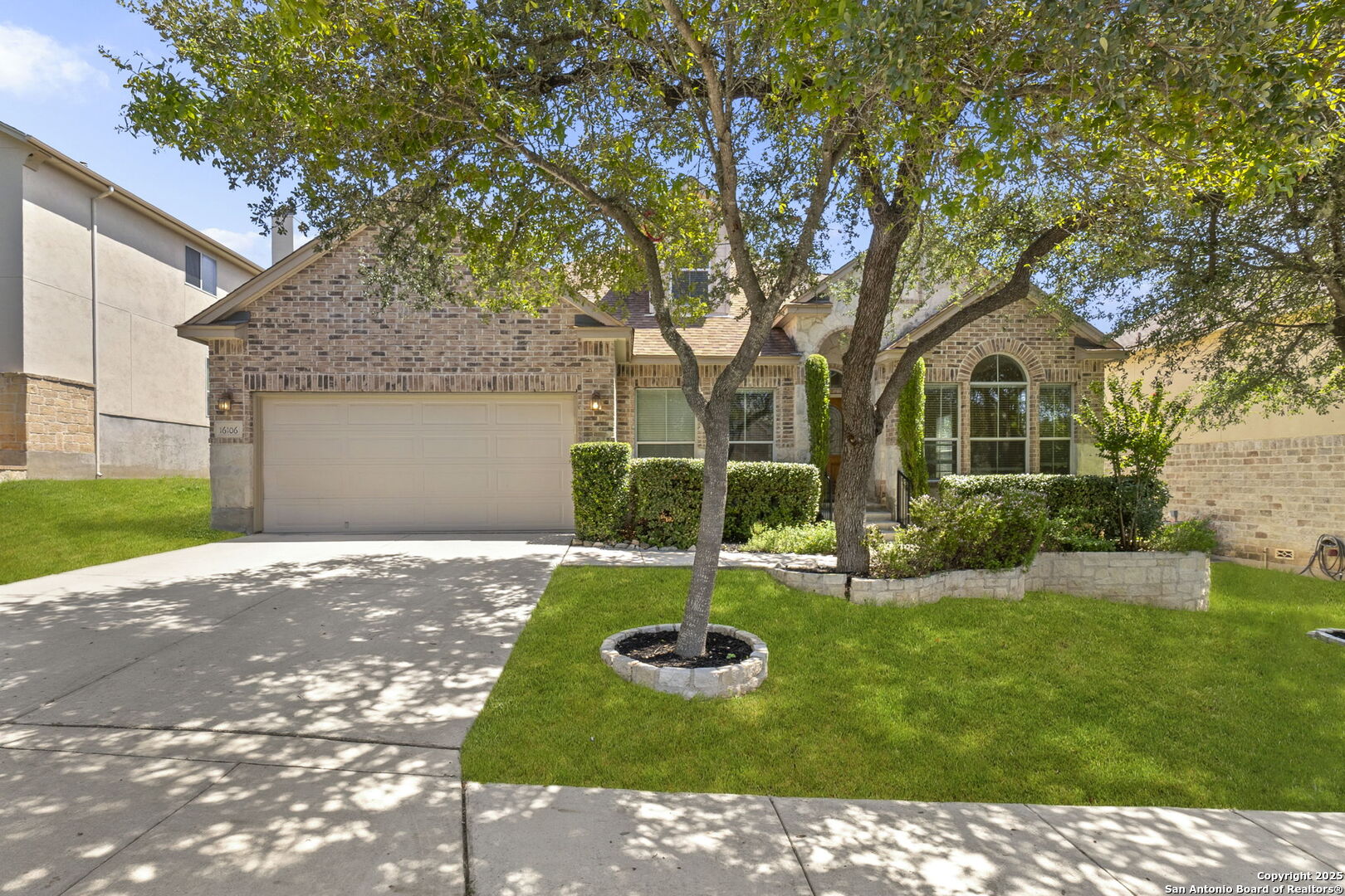 16106 Ponderosa Pth Helotes, TX 78023 - Photo 2 of 40 front view of a house with a yard