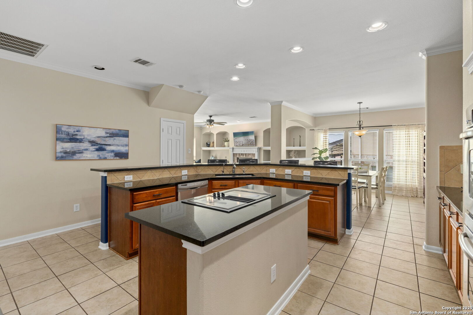 16106 Ponderosa Pth Helotes, TX 78023 - Photo 21 of 40 a kitchen with stainless steel appliances granite countertop a stove a sink and a refrigerator