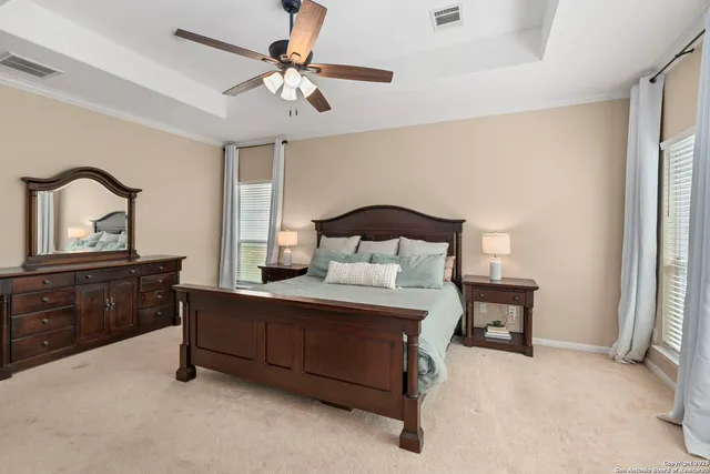 a bedroom with a bed window and a table