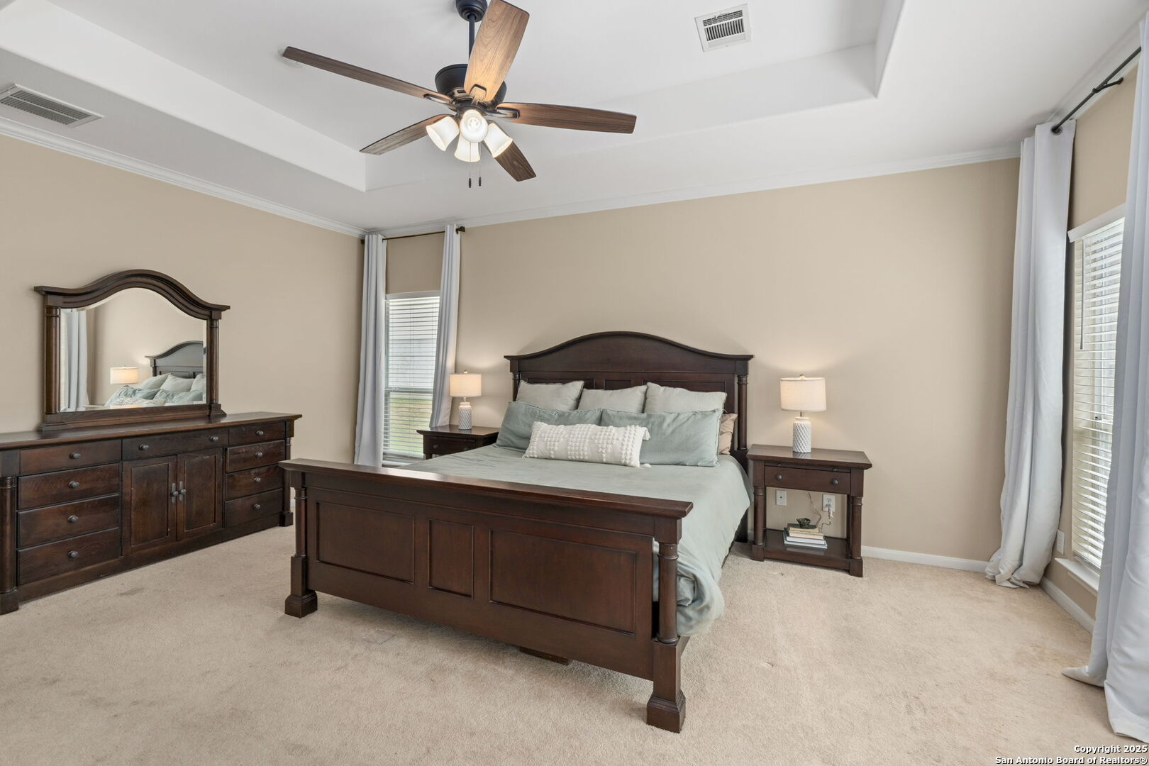 16106 Ponderosa Pth Helotes, TX 78023 - Photo 24 of 40 a bedroom with a bed window and a table