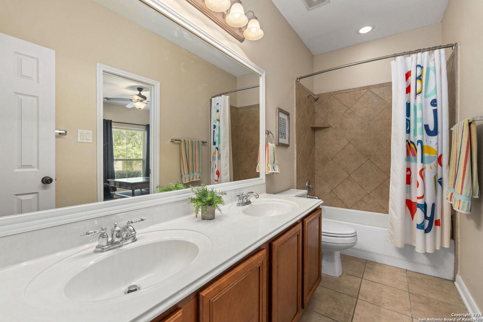 16106 Ponderosa Pth Helotes, TX 78023 - Photo 27 of 40 a bathroom with a sink a toilet and shower