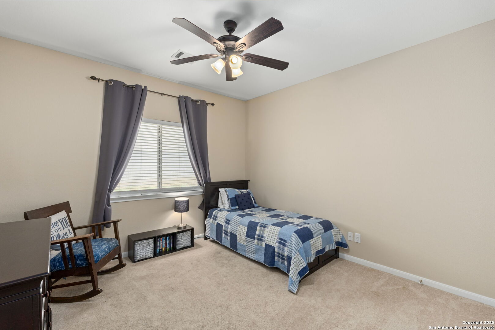 16106 Ponderosa Pth Helotes, TX 78023 - Photo 29 of 40 a bedroom with a bed a window and a chandelier