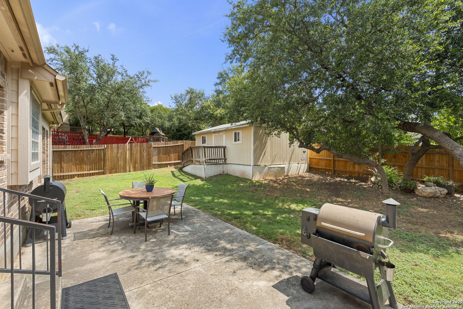 16106 Ponderosa Pth Helotes, TX 78023 - Photo 35 of 40 a backyard of a house with outdoor seating