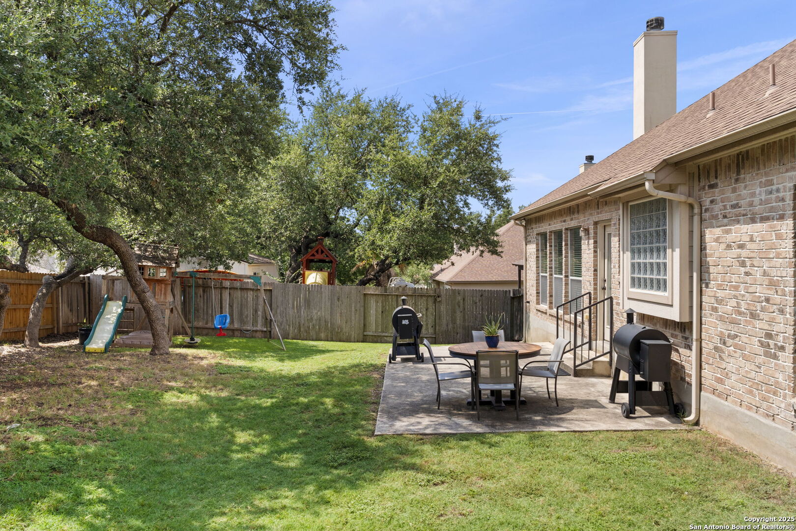 16106 Ponderosa Pth Helotes, TX 78023 - Photo 36 of 40 a view of a house with backyard and sitting area