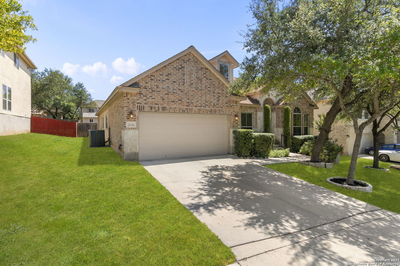 16106 Ponderosa Pth Helotes, TX 78023 - Photo 38 of 40 a front view of house with yard and green space