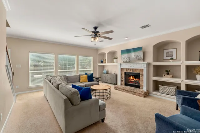 a living room with furniture and a fireplace